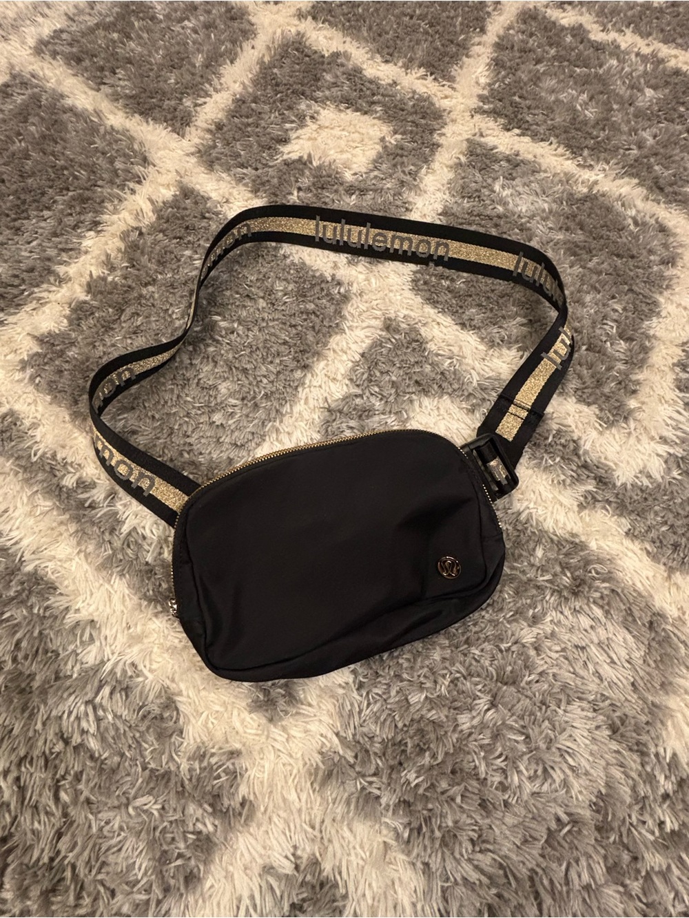 Lululemon everywhere belt bag metallic word mark in gold and black. Like new